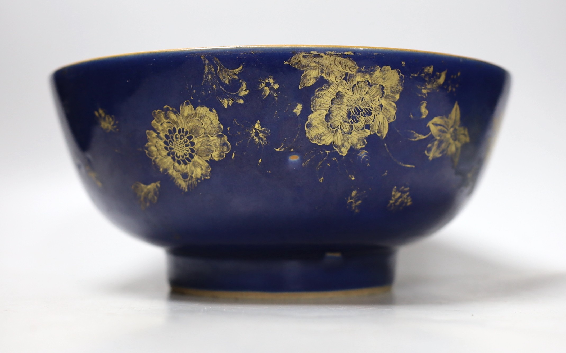 An 18th century Chinese gilt decorated powder blue glazed bowl, 26cm diameter